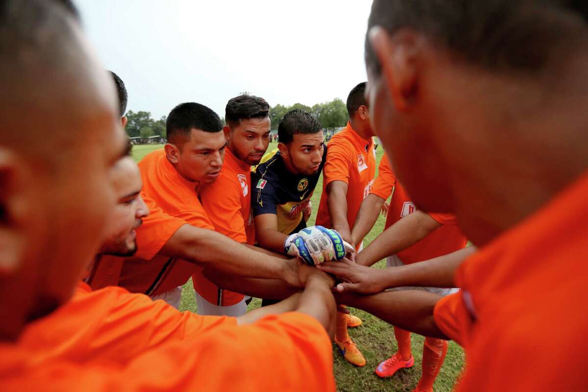 Marcos Sanchez, the goalkeeper for Paredes' team, brings the players together before the game.