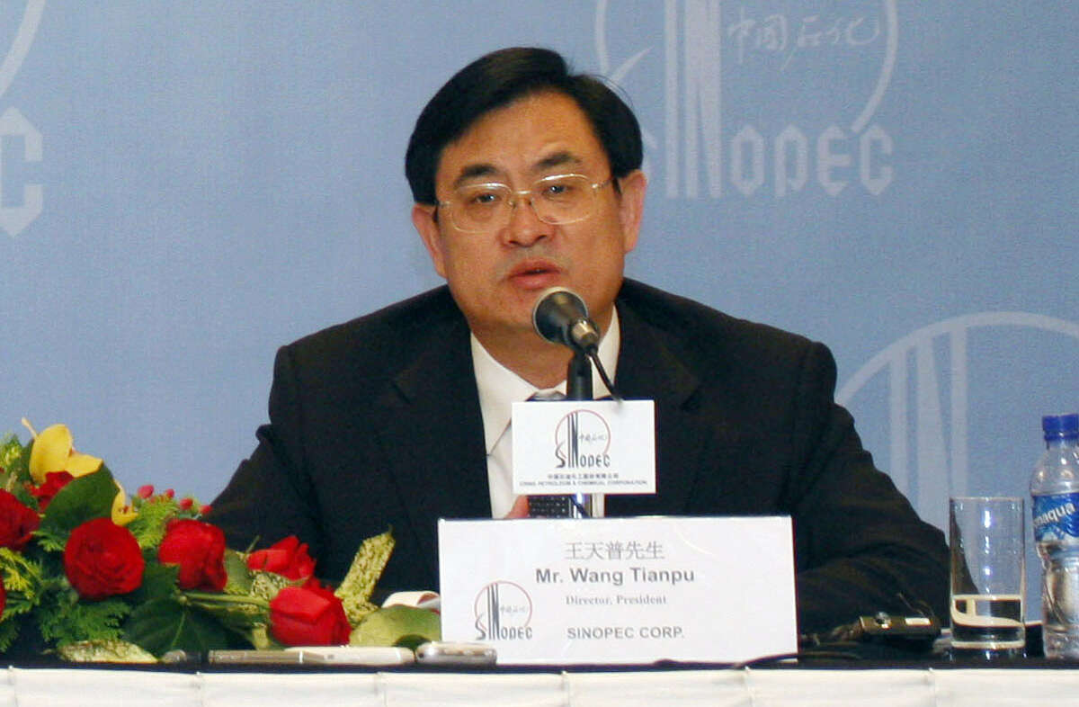 FILE - In this Monday, April 7, 2008 file photo, Sinopec President Wang Tianpu attends a news conference announcing the firm's annual results in Hong Kong. China's ruling Communist Party said Friday, Sept. 18, 2015, that it is stripping Wang, the former general manager of the country's largest oil refiner, of party membership and handing him over to prosecutors after an internal investigation found evidence of corruption. (AP Photo/Vincent Yu, File)
