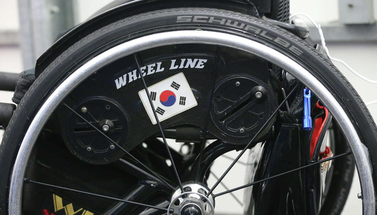 A Korean flag is on a wheelchair Thursday September 17, 2015 as ther South Korean paralympic sled hockey team practices during a scrimmage against the San Antonio Rampage paralympic hockey team at the Ice and Golf Center at Northwoods. They are practicing for the 2018 Winter Paralympics in Pyeongchang, South Korea.