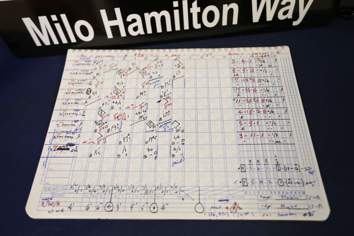 A page out of a scorebook is displayed at a memorial set up for Milo Hamilton before the start of an MLB baseball game at Minute Maid Park on Friday, Sept. 18, 2015. Milo passed away Sept. 17 at the age of 88. ( Karen Warren / Houston Chronicle )