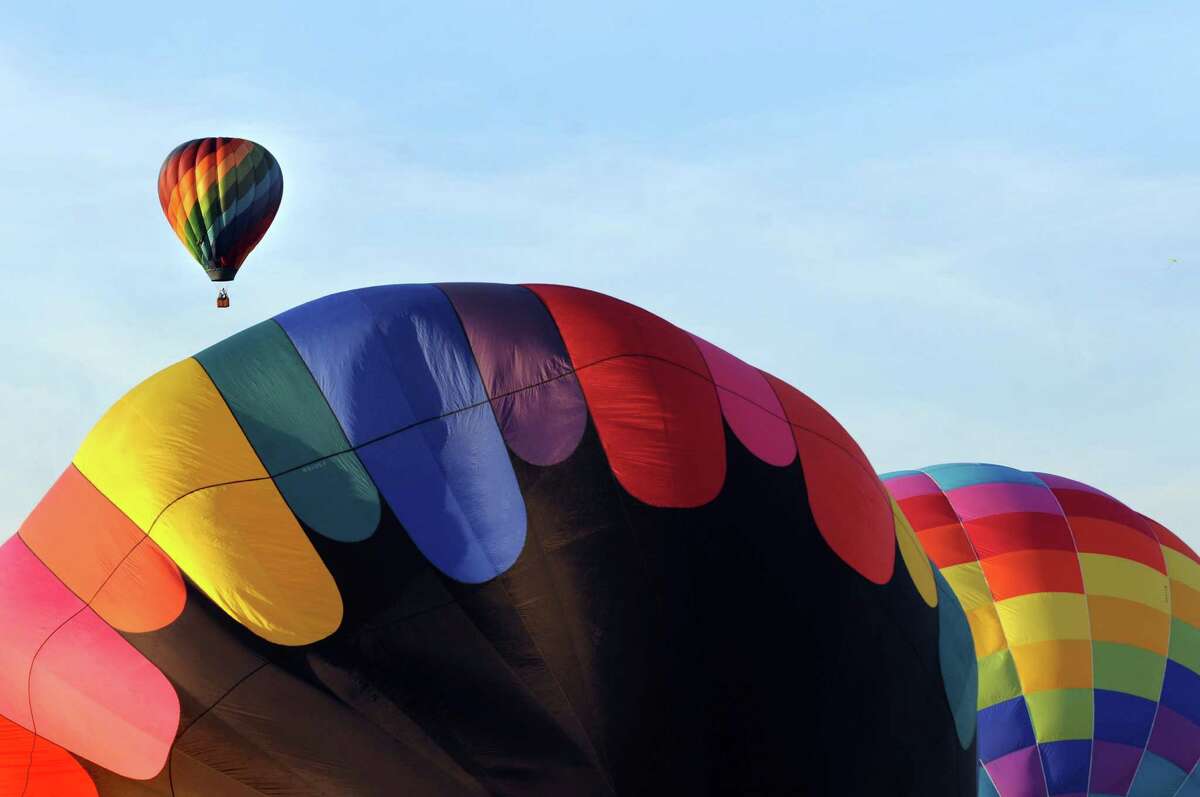 Hot air balloons lift off during the Adirondack Balloon Festival on Friday, Sept. 18, 2015, at Floyd Bennett Memorial Airport in Queensbury, N.Y. Flight times are 6:30 a.m. and 5 p.m. on Saturday and Sunday.(Cindy Schultz / Times Union)