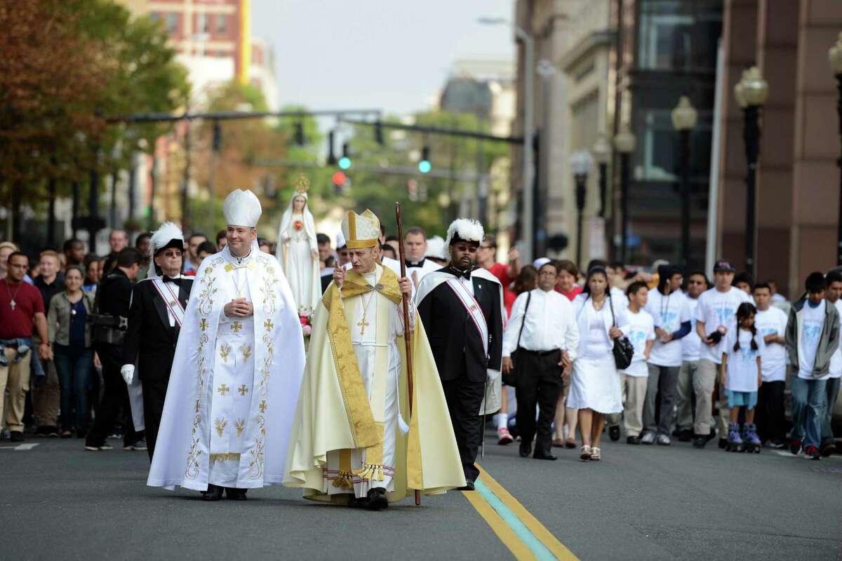 Bishop Caggiano and area clergy and youth walk in a procession with the statue of the Blessed Mother through downtown Bridgeport Saturday, Sept. 19, 2015 to the Webster Bank Arena for the Diocese of Bridgeport Synod Celebration. The closing Mass of Synod 2014 is the culmination of an 18-month journey of renewal for the Diocese of Bridgeport.