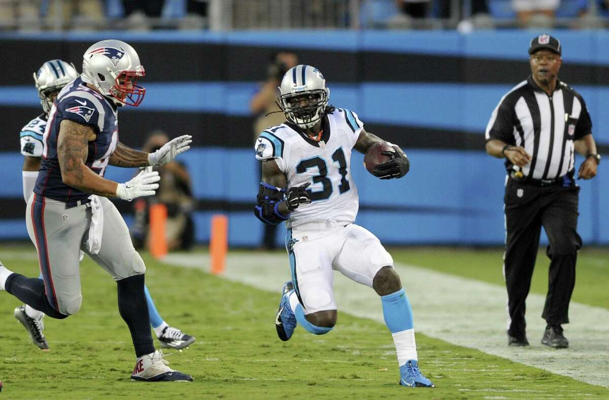 Carolina Panthers defensive back Charles Tillman (31) runs the ball during a pre-season NFL football game against the New England Patriots Friday, Aug. 28, 2015 in Charlotte, N.C. (AP Photo/Mike McCarn)