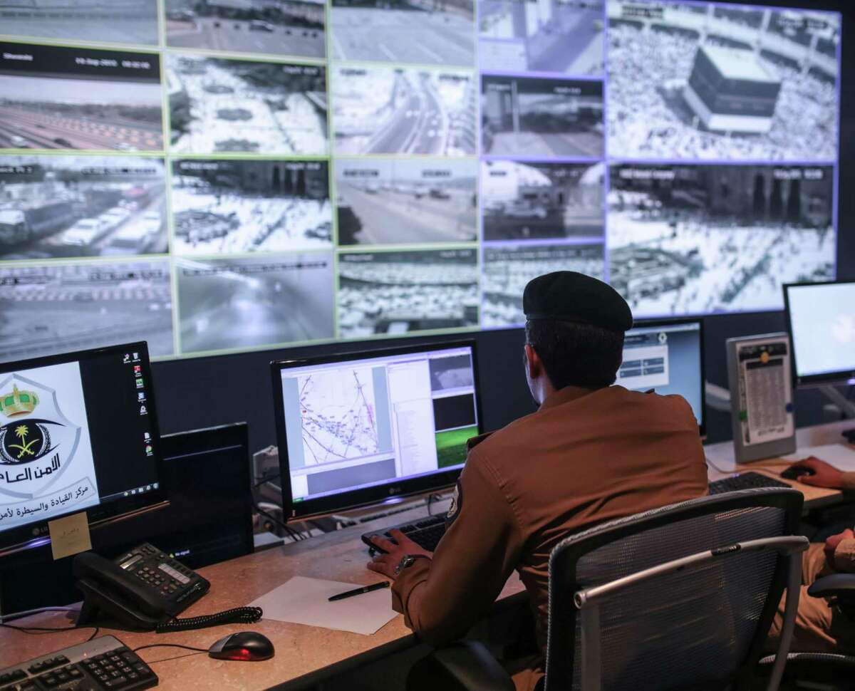 A Saudi security officer monitors surveillance screens with live views of Muslim pilgrims in the holy city of Mecca, along with highways and high density areas, a few days before the start of the annual pilgrimage﻿ known as the hajj﻿ in Mecca, Saudi Arabia, on Saturday.﻿