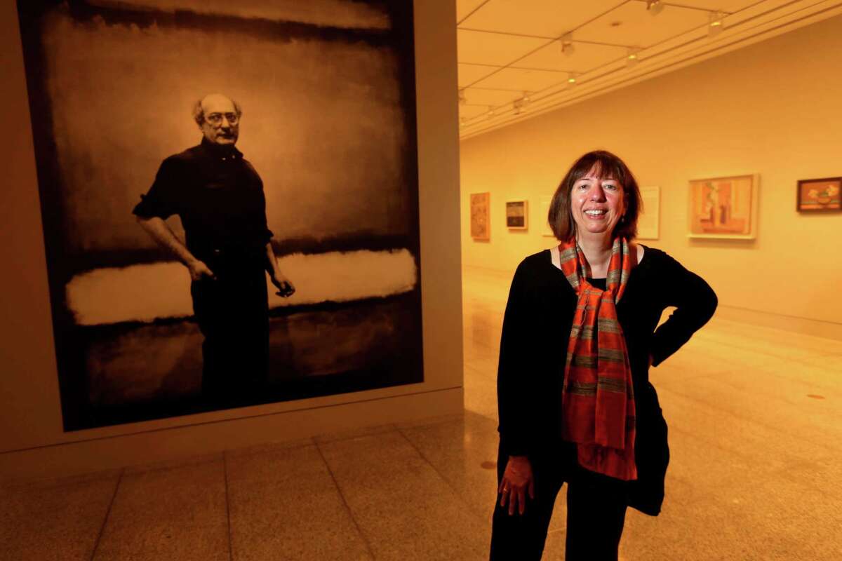 Alison De Lima Greene, curator of contemporary art and special subjects, shown with a portrait of artist Mark Rothko, at a preview of the exhibition "Mark Rothko: A Retrospective" in the Audrey Jones Beck Building at the Museum of Fine Arts Thursday, Sept. 17, 2015, in Houston. ( Gary Coronado / Houston Chronicle )