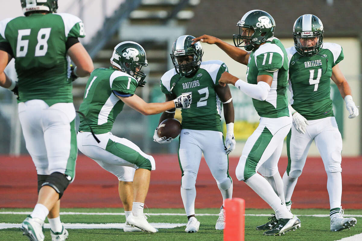 The Reagan Rattlers celebrate Marquis Duncan's (center) 37-yard touchdown reception during the first half of their game with East Central at Comalander Stadium on Saturday, Sept. 19, 2015. MARVIN PFEIFFER/ mpfeiffer@express-news.net