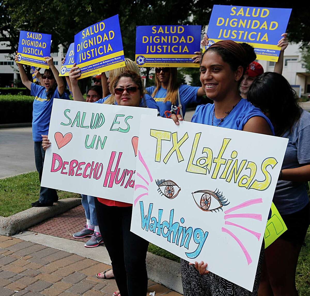 The National Latina Institute for Reproductive Health (NLIRH) group protest outside the Memorial Hermann clinic headquarters on the arrest of Blanca Borrego, a Latina mom and undocumented woman, in Northeast Women's Healthcare clinic in Atascocita, Texas, Borrego was arrested her for allegedly using a false ID Saturday, Sept. 19, 2015, in Houston.