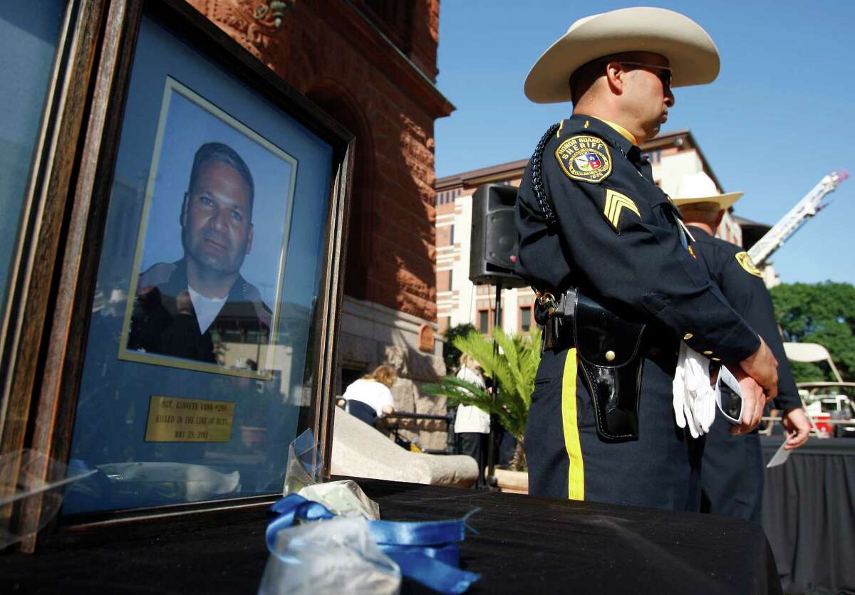 A picture of Bexar County Sheriff’s Sgt. Kenneth Vann, who was killed in 2011, is displayed during the annual memorial service for fallen deputies in May 2014.