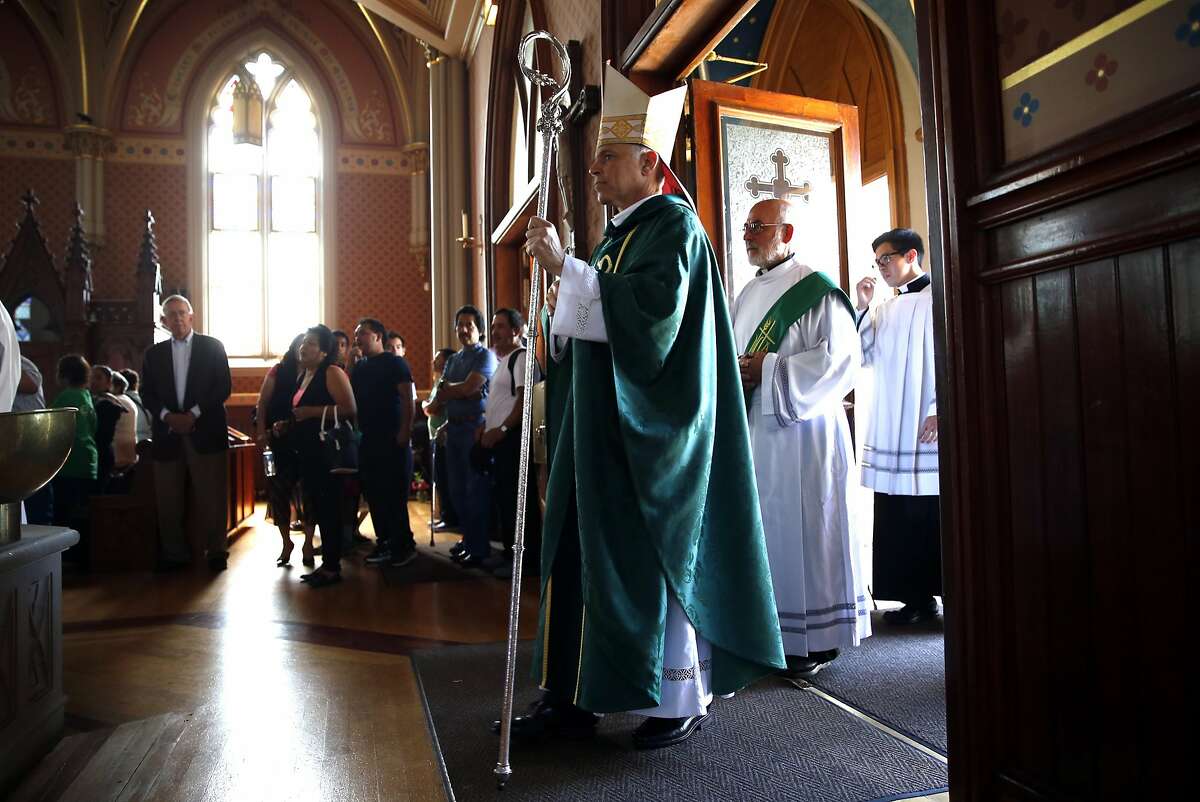 San Francisco Archbishop Salvatore Cordileone waits to process during a mass for St. Peter's Church parishioners who will be making a pilgrimage to Washington, DC to see Pope Francis. Photographed in San Francisco, Calif., on Sunday, September 20, 2015.