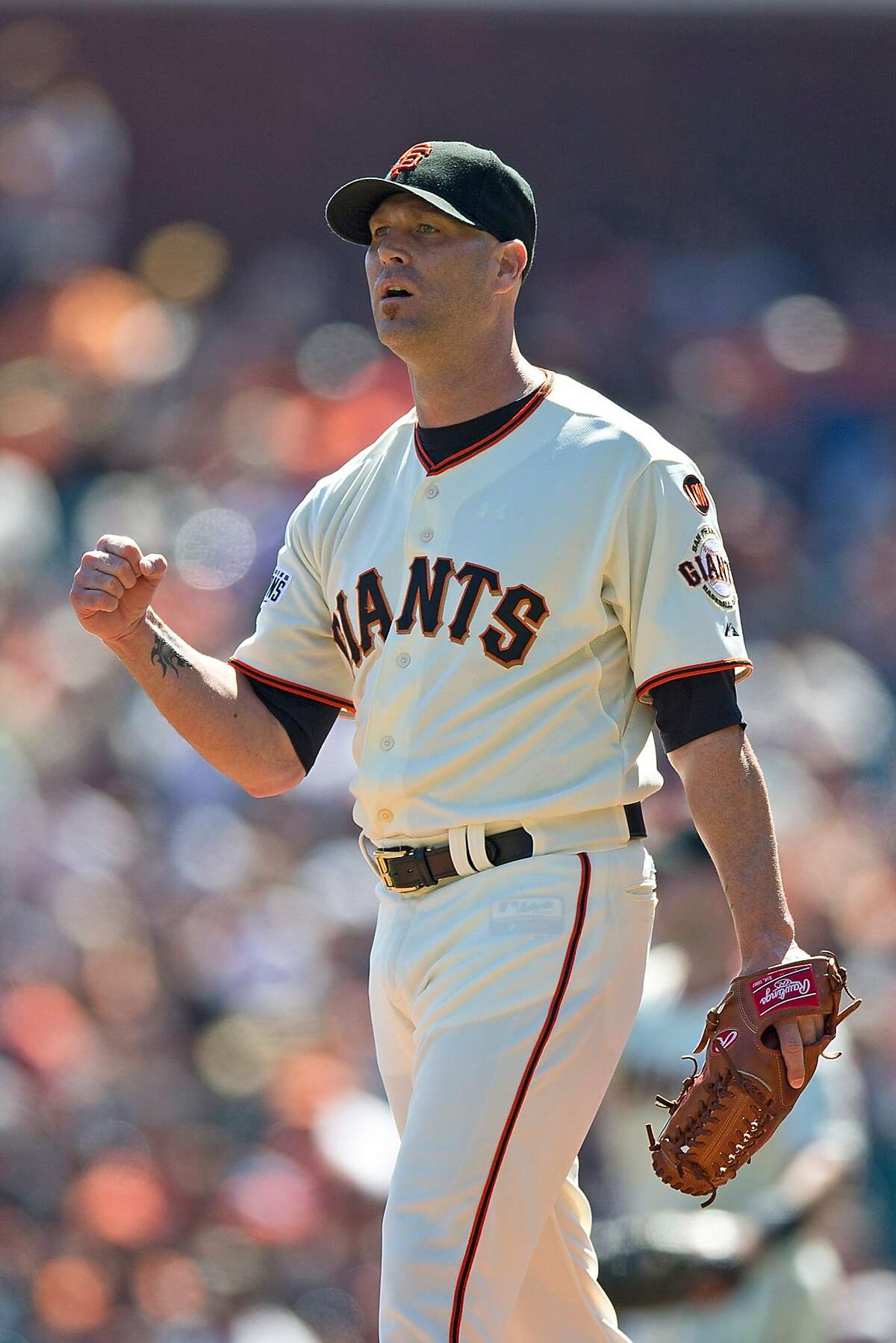 Tim Hudson of the San Francisco Giants celebrates after a play by Brandon Crawford (not pictured) against the Arizona Diamondbacks during the first inning at AT&T Park on September 20, 2015 in San Francisco, California.