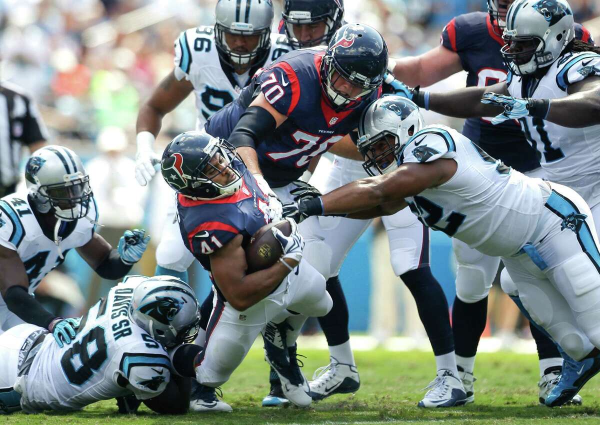 Texans running back Jonathan Grimes (41) is tackled by Panthers linebacker Thomas Davis, lower left. Grimes carried twice for 7 yards.