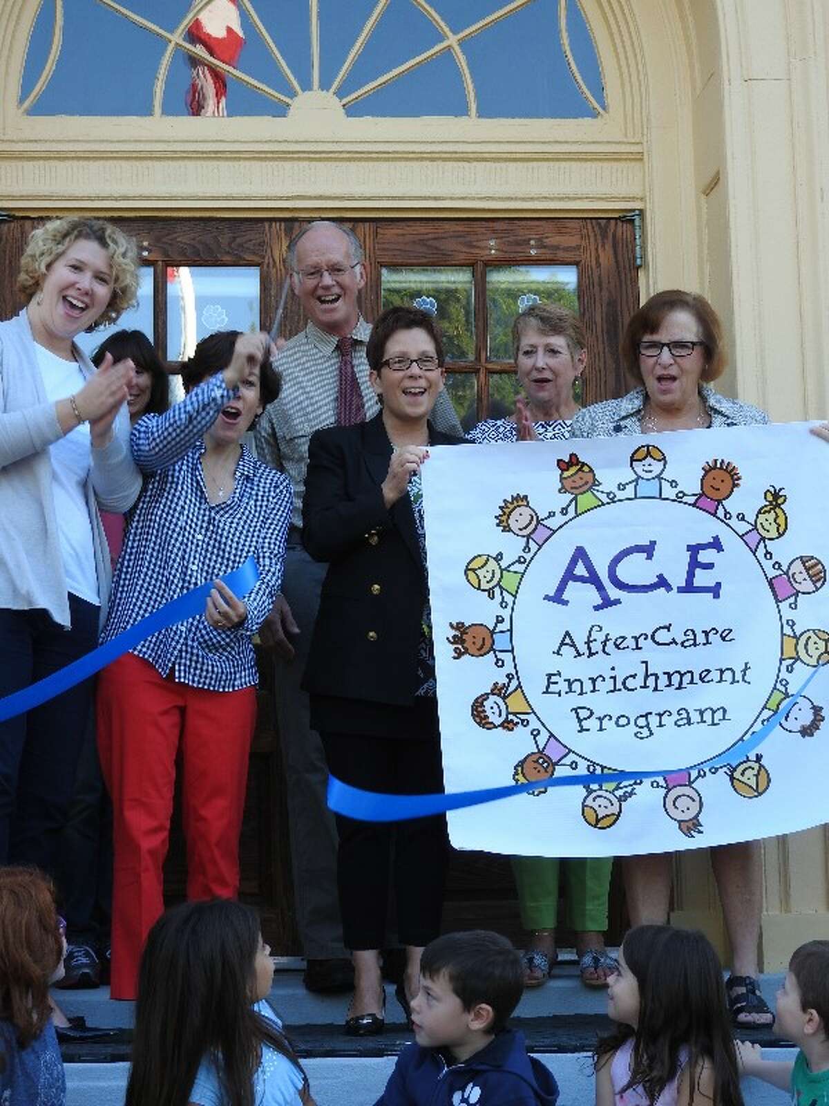 The AfterCare Enrichment Program (ACE) is launched Sept. 18 with L to R: Carolan Dwyer, founder; Brienne Leslie, assistant director; Lanie Flanagan, director; Curtis Read, first selectman; Cathy Colella, principal; Susan Niesobecki, advisory committee; and Pat Cosentino, Superintendent of Schools.