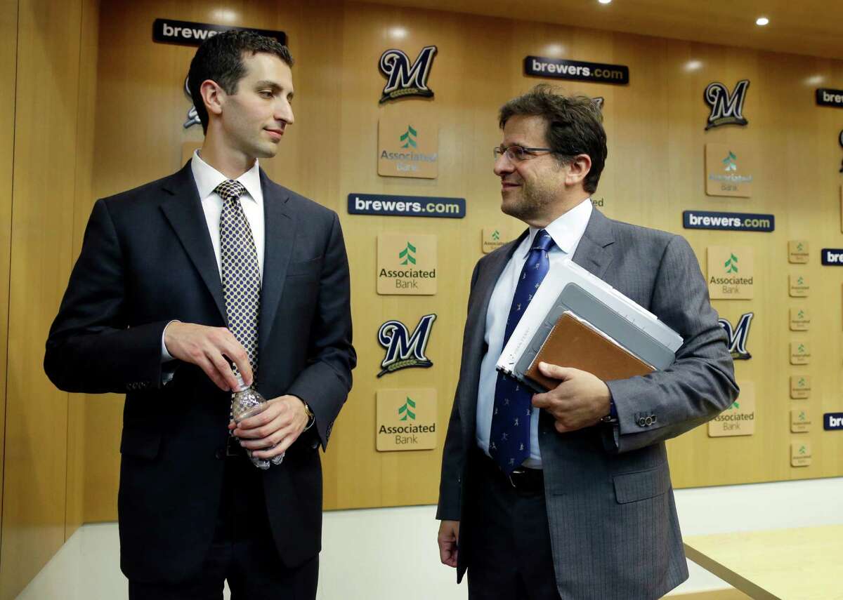 David Stearns talks to Milwaukee Brewers owner Mark Attanasio a news conference Monday, Sept. 21, 2015, in Milwaukee. Stearns was introduced as the Brewers' new general manager. (AP Photo/Morry Gash)