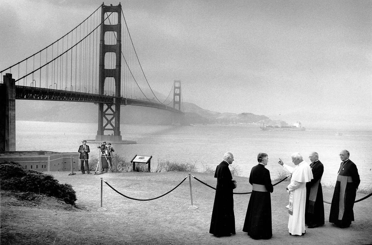 Pope John Paul II with archbishop John Quinn (to his left) within view of the Golden Gate Bridge on Sept. 18, 1987.