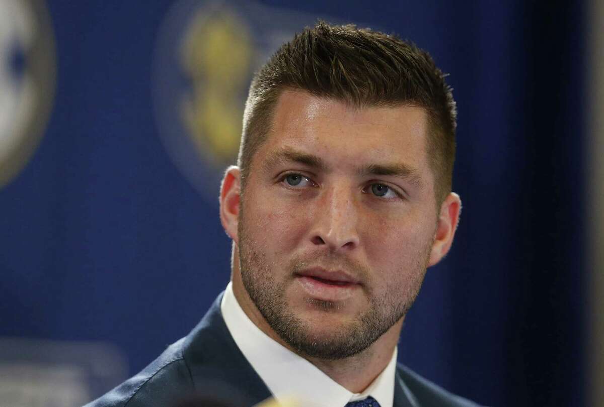 FILE - In this Dec. 5, 2014, file photo, Tim Tebow speaks during an SEC television broadcast in Atlanta. Tebow worked out Monday, March 16, 2015, for the Philadelphia Eagles, a person familiar with the session tells The Associated Press. The person spoke on condition of anonymity because the workout was not made public. (AP Photo/Brynn Anderson, File)