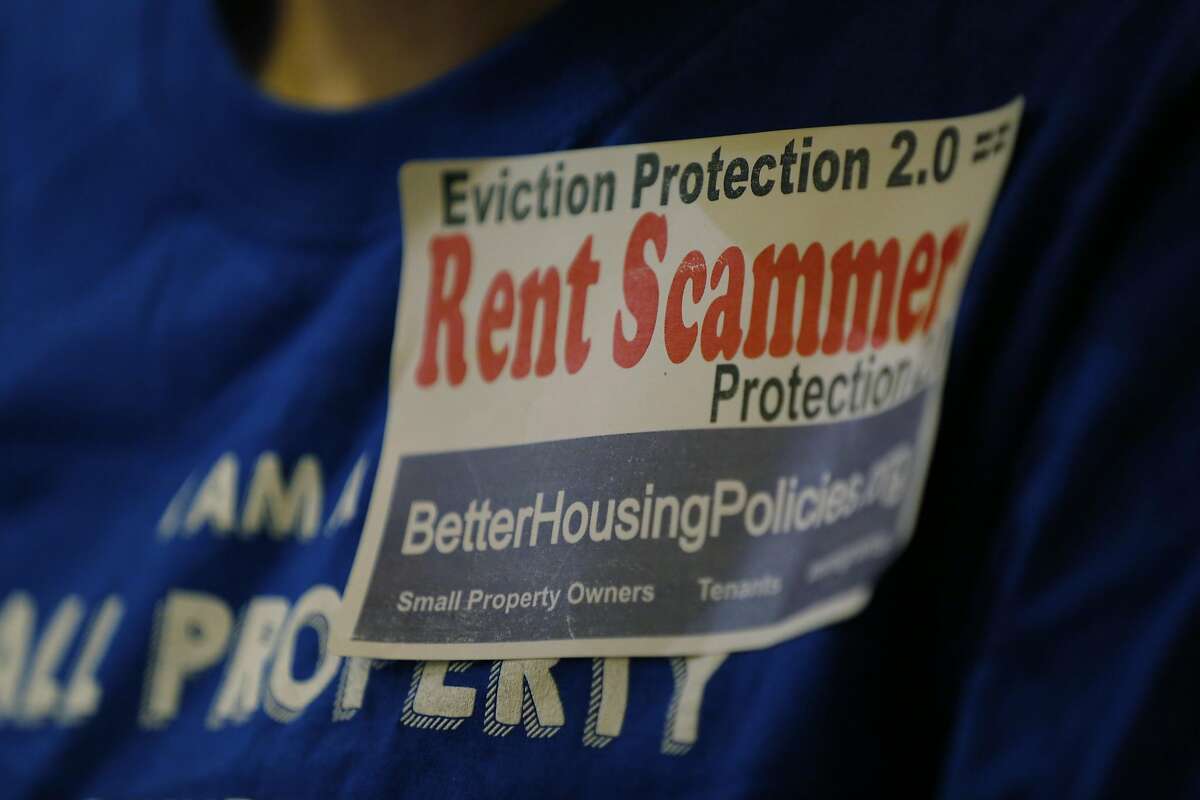 A sticker on the shirt of an opponent of new eviction protection legislation at a San Francisco Board of Supervisors meeting at City Hall in San Francisco, California, on Tuesday, Sept. 22, 2015.