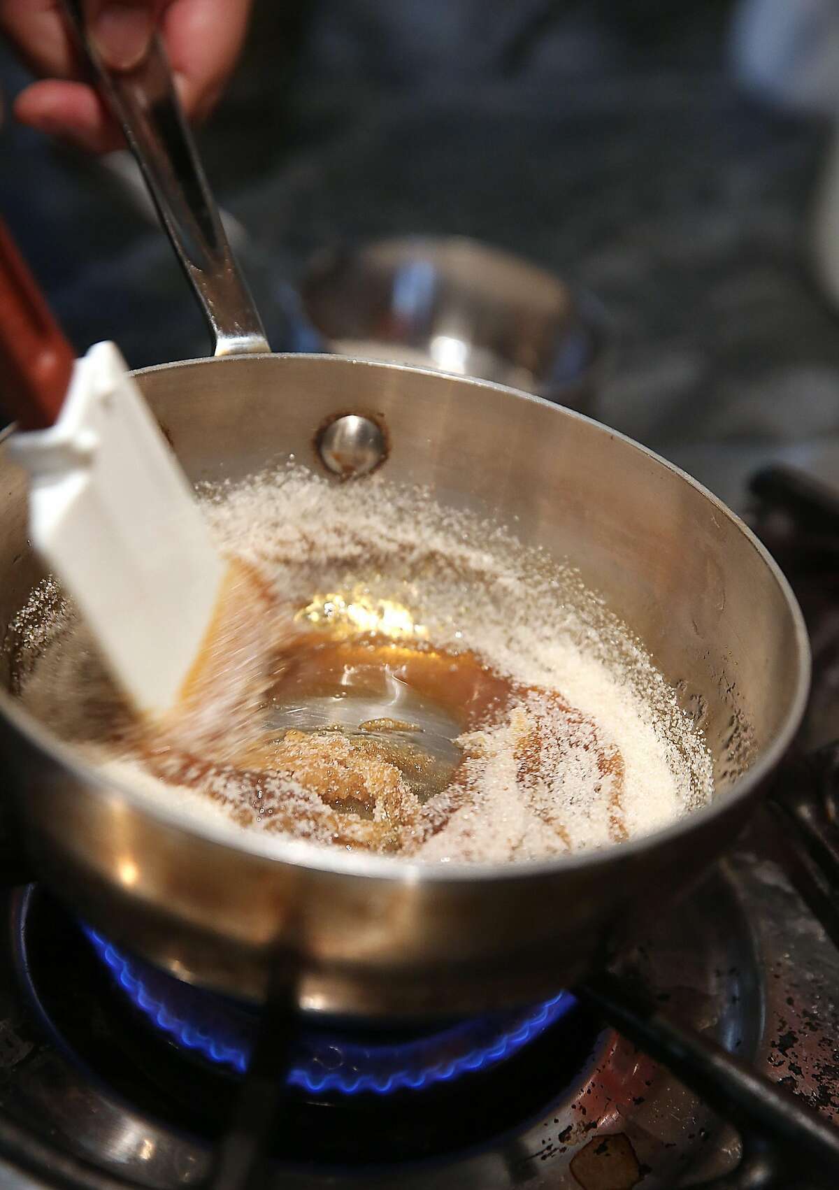 BiRite Creamery co-owner Kris Hoogerhyde shows how to make caramel for baked Alaska in San Francisco, Calif., on Tuesday, September 22, 2015.