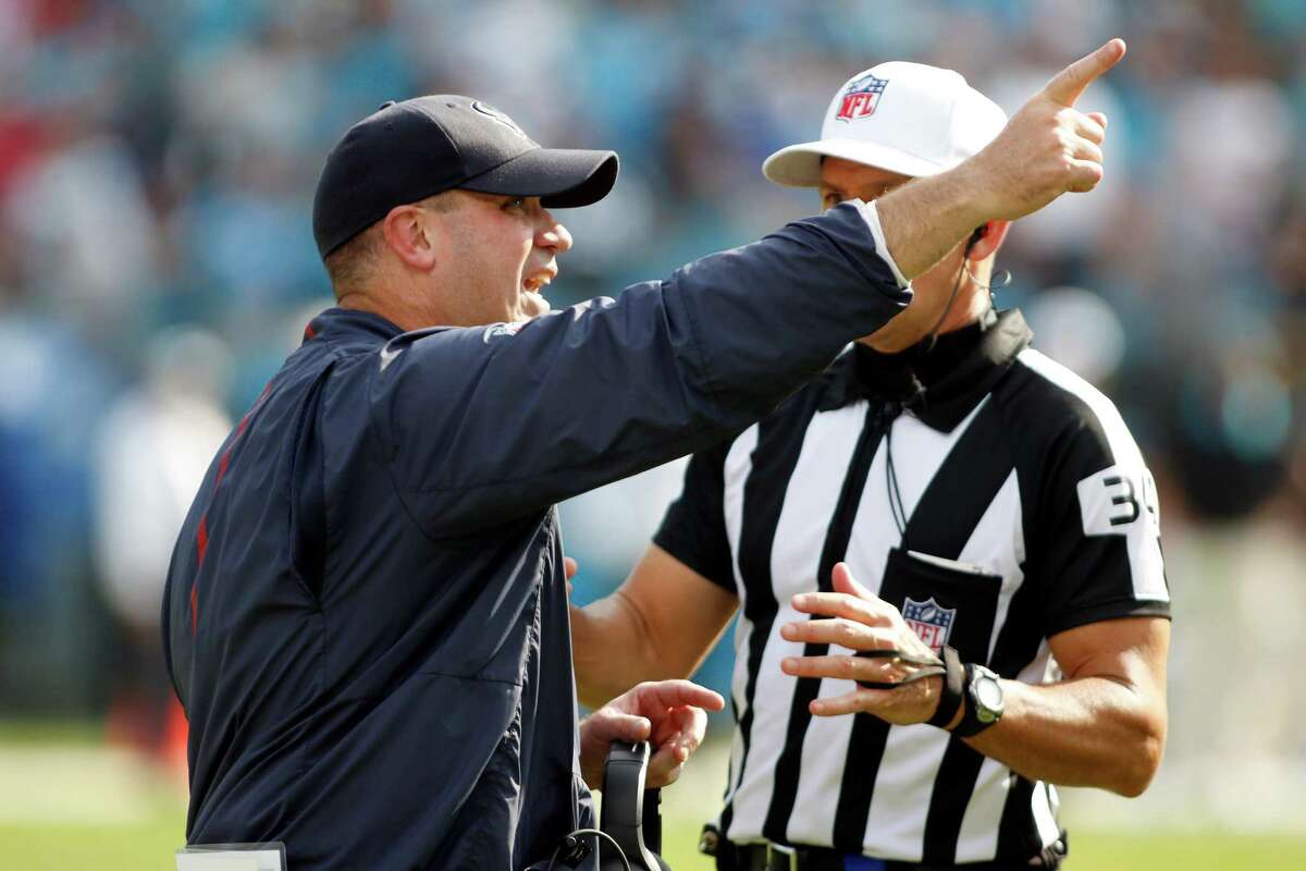 Houston Texans head coach Bill O’Brien argues a call with referee Clete Blakeman (34) on the sidelines against the Carolina Panthers during the second half of an NFL football game in Charlotte, N.C., Sunday, Sept. 20, 2015. The Panthers won 24-17.