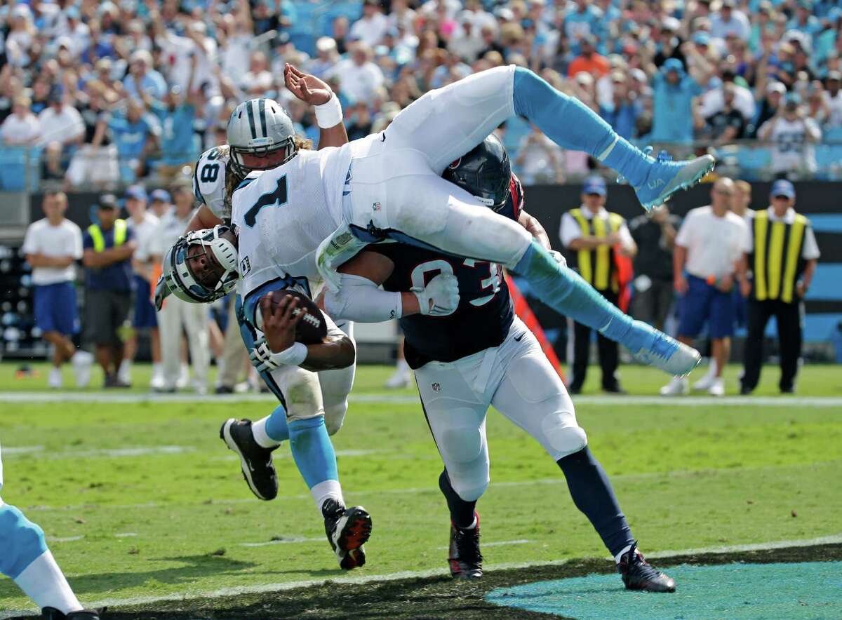 Carolina Panthers’ Cam Newton (1) leaps for a touchdown against the Houston Texans during the second half of an NFL football game in Charlotte, N.C., Sunday, Sept. 20, 2015.