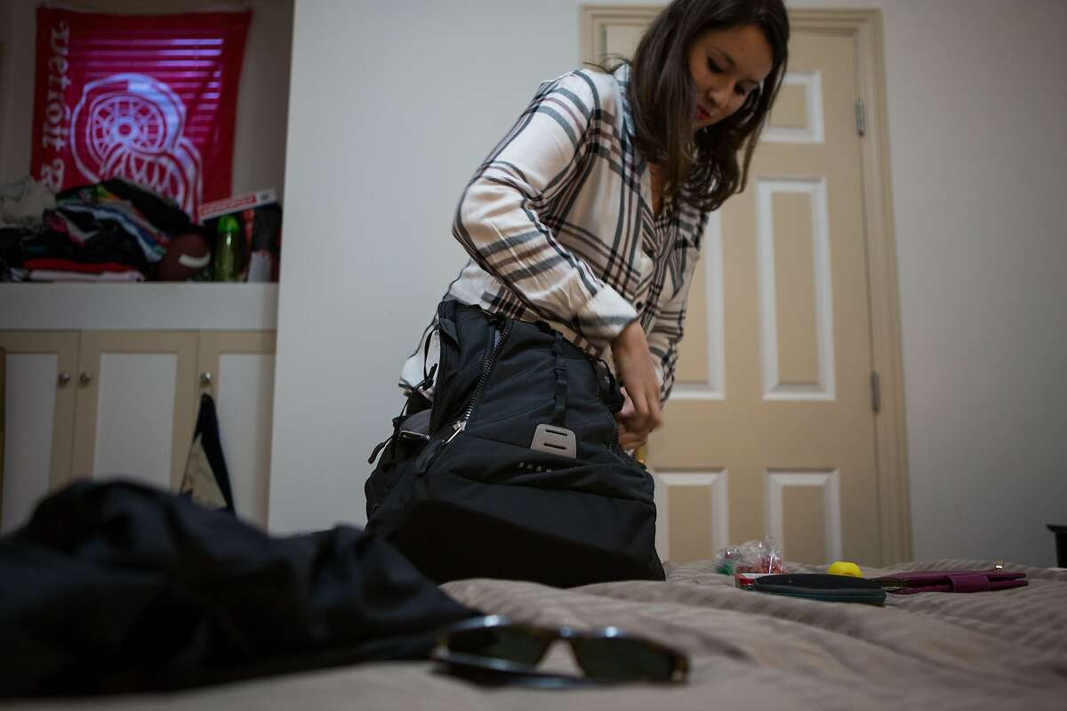 Alexandra Revelli, an employee with Expensify, packs for her fourth trip with the company on Tuesday, Sept. 22, 2015 in San Francisco, Calif. Expensify takes their entire staff to a remote and beautiful location for one month every year, all expenses paid, to work.