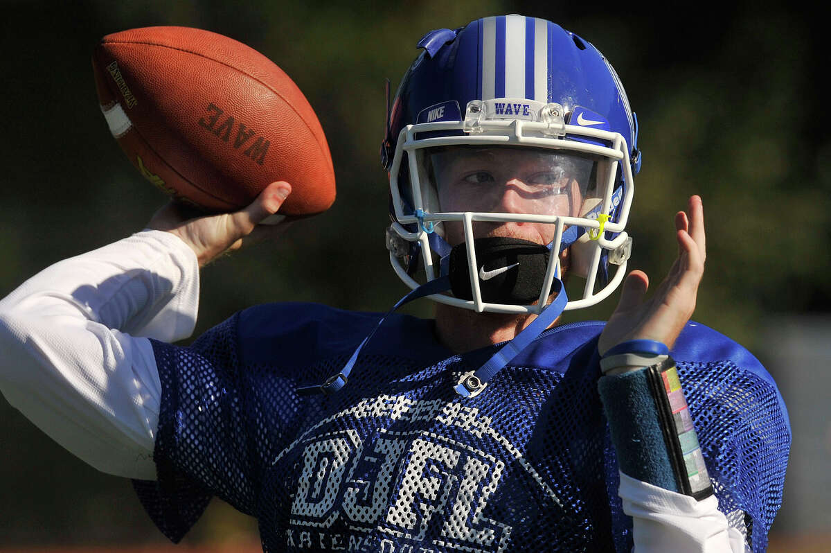 Captain and quaterback Timmy Graham throws the ball during Darien High School football practice at Darien High School in Darien, Conn., on Tuesday, Sept. 15, 2015. Darien's first game is this Friday at 6:30 p.m. at Stamford High School.