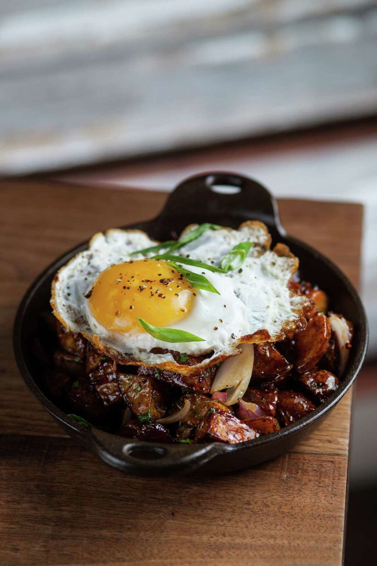 Underbelly: Potatoes with bacon jam, and a duck egg.