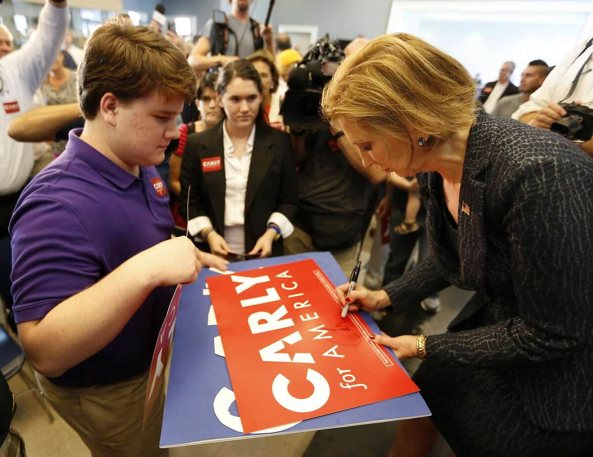 Republican presidential candidate, businesswoman Carly Fiorina, greets a supporter after speakng to South Carolina residents during a town hall meeting concerning foreign affairs at Johnson Hagood Stadium on the campus of The Citadel in Charleston, S.C., Tuesday, Sept. 22, 2015. (AP Photo/Mic Smith)