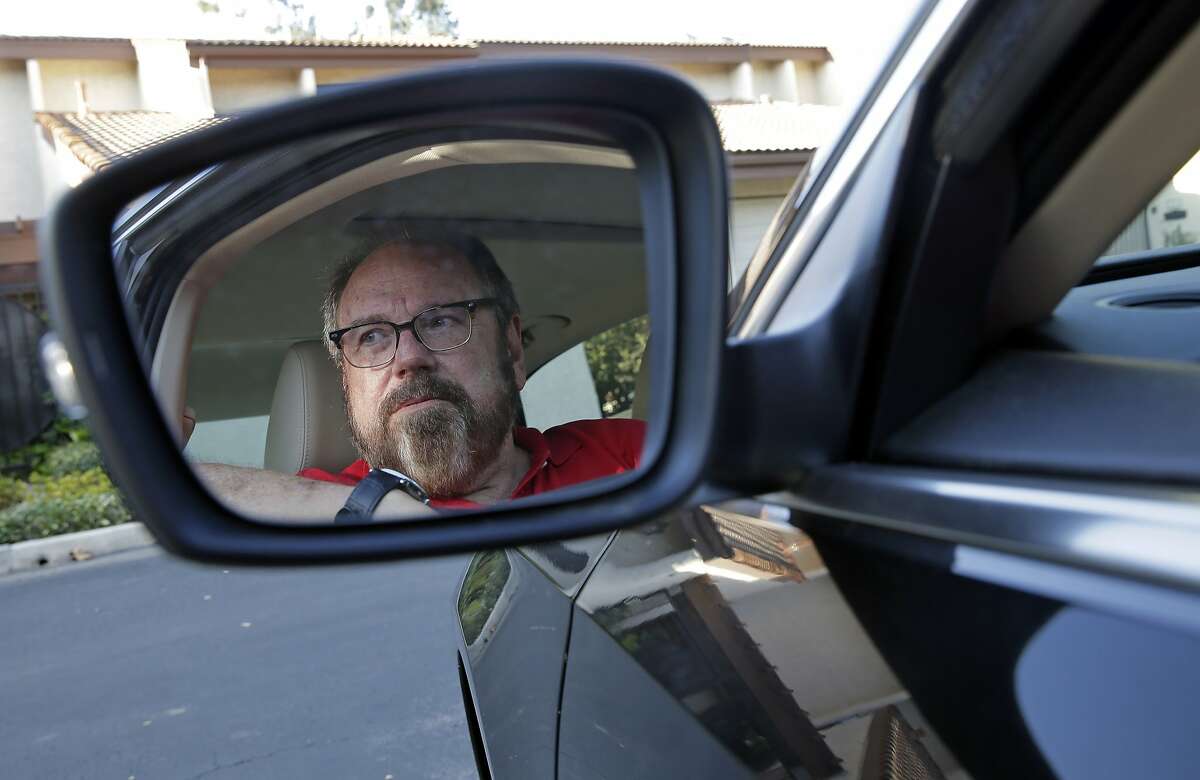 Bob Rand poses for a photo in his 2014, fully loaded Volkswagen diesel Passat on Wednesday, Sept. 23, 2015, in Pasadena, Calif. Rand convinced his son and his friend to buy the same car for environmental reasons. Now he's trying to sell it. (AP Photo/Chris Carlson)