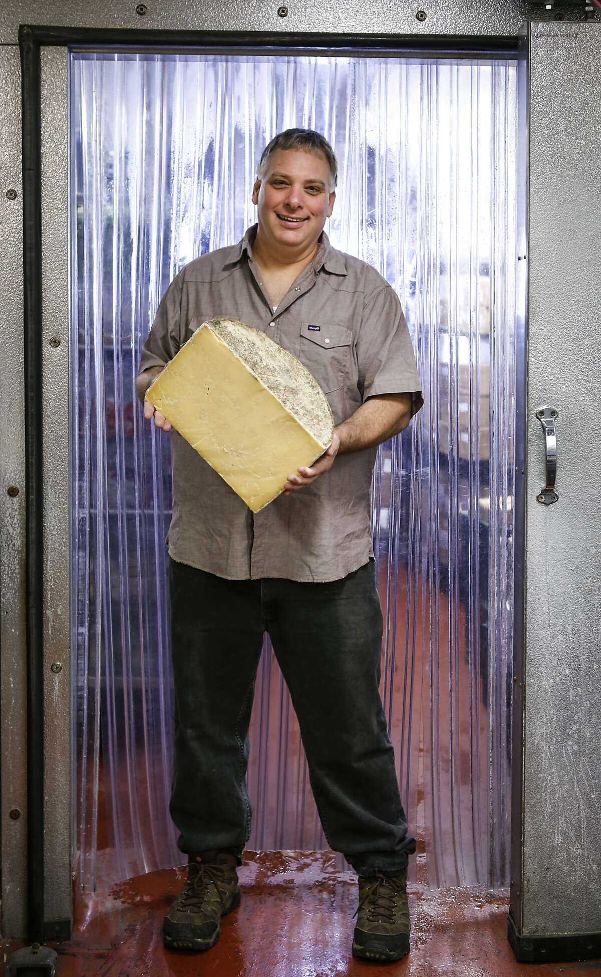 Gordon Edgar, the cheese buyer at Rainbow Grocery, seen on Thursday, Sept. 24, 2015 in San Francisco, Calif., is coming out with a new book about cheddar which is what he calls the iconic American cheese.