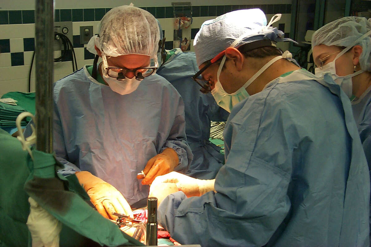 Dr. Francisco Cigarroa performs a liver transplant with Dr. Robert Esterl at the UT Health Science Center in 2009. After stints as the UTHSC president and UT System chancellor, he’s back to his first love, working as director of pediatric transplant surgery and professor at the School of Medicine at the UTHSC in San Antonio.