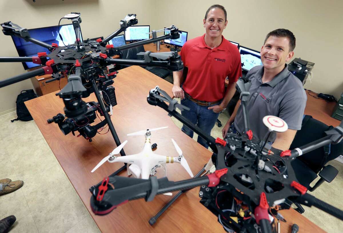 Landon Phillips (left) and Steven Fargo display some of the   copter-style drones they use in at Midstream Integrity. 
