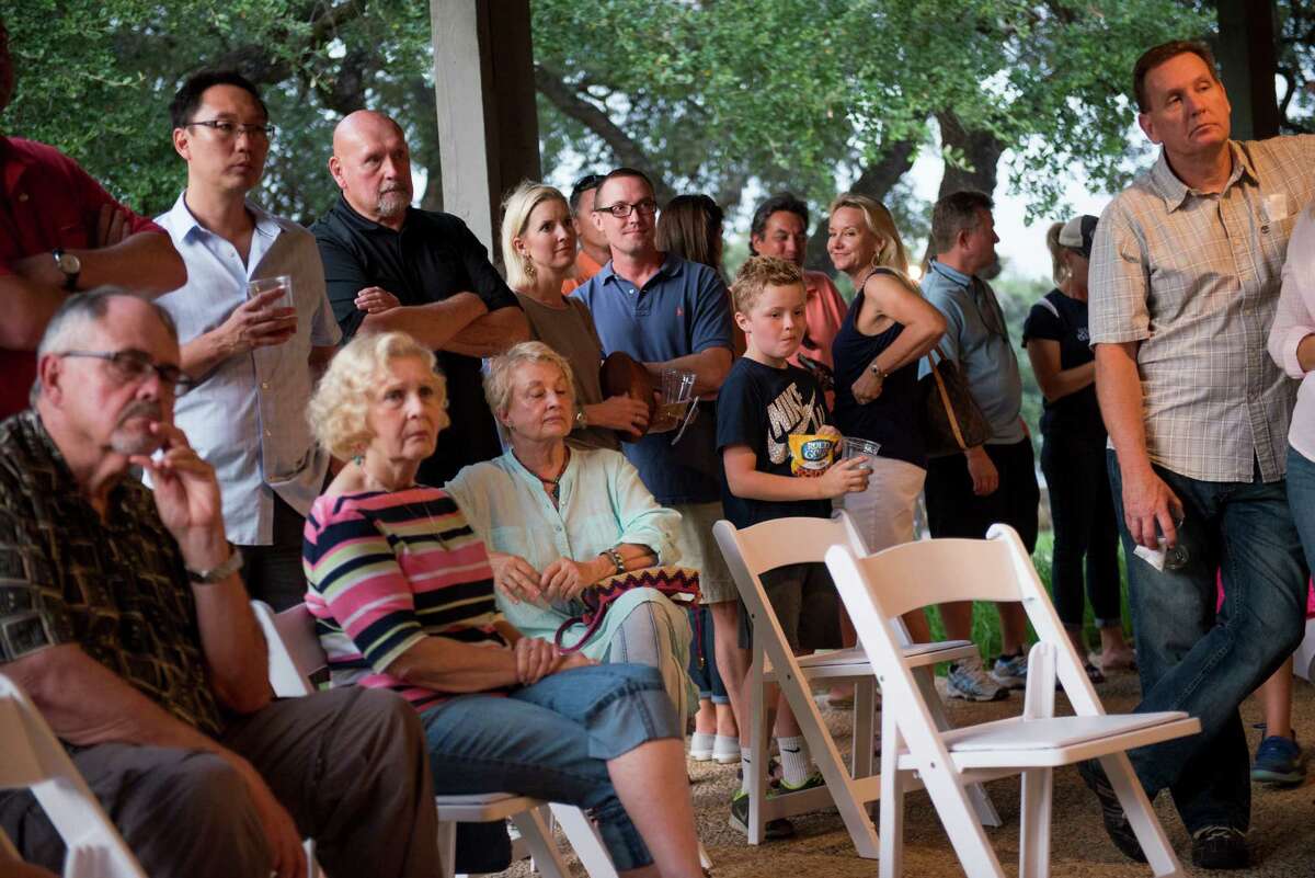 Residents listen to a speaker during an informational rally where fourteen neighborhood associations, off the U.S. 281 corridor, expressed their opposition to the city of San Antonio's plans to annex them at Canyon Springs Golf Club on Friday, September 25, 2015.