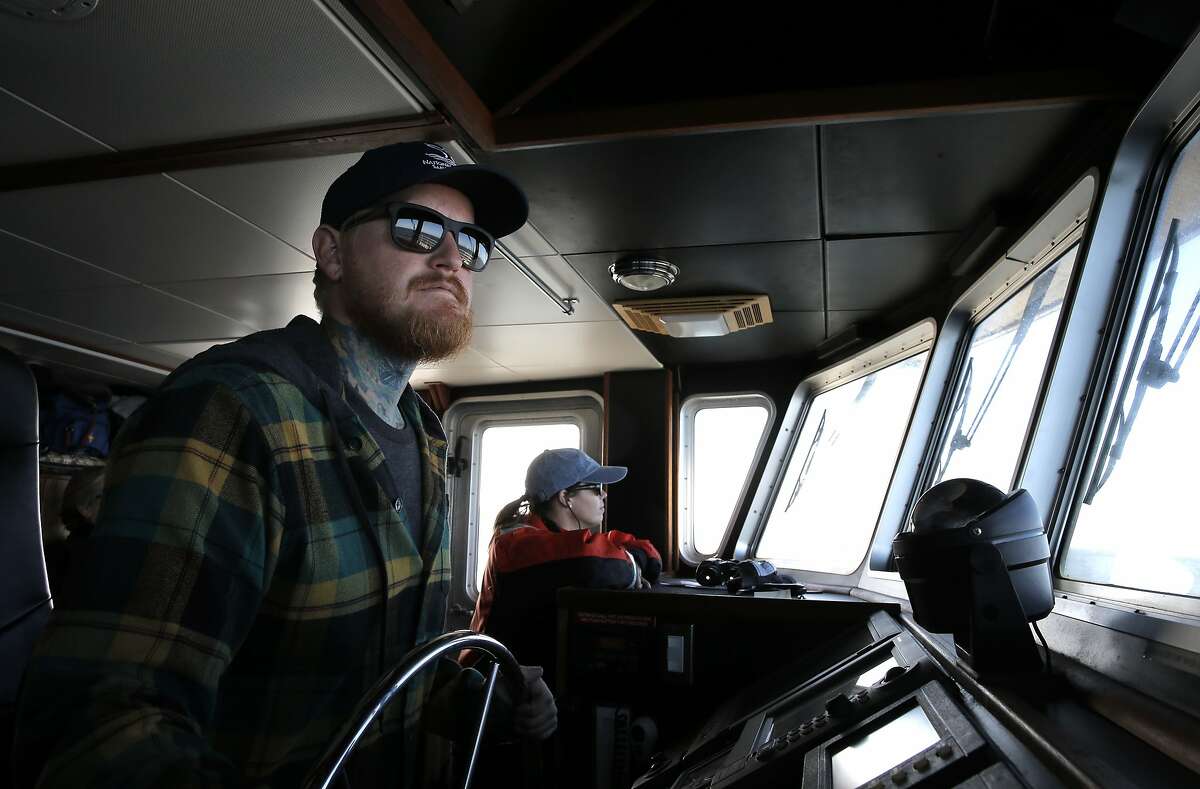 The ship's captain Chris Eubank and researchers Danielle Lipski scan the ocean from the bridge aboard the research vessel Fulmar, near San Francisco, Calif. on Fri. September 25, 2015. The crew of the Fulmar conducts the study ACCESS (Applied California Current Ecosystems Studies) a partnership that uses ocean research to inform resource managers, policy makers and conservation partners.