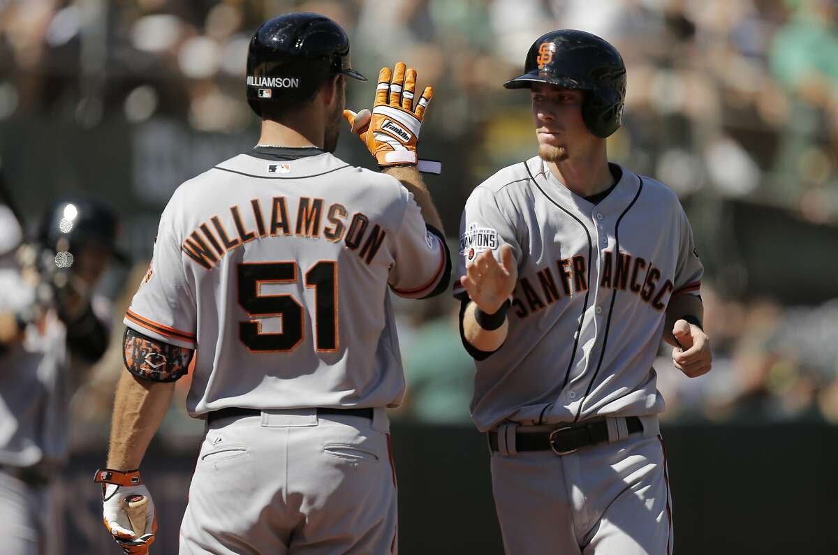 Giants Matt Duffy scores a run in the first on a double by Marlon Byrd, as the San Francisco Giants take on the Oakland Athletics at O.co Coliseum, Calif. on Sat. September 26, 2015.