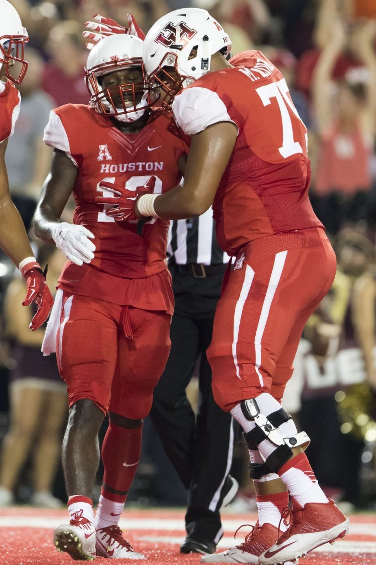 Houston Cougars' wide receiver Demarcus Ayers (10) celebrates with offensive lineman Marcus Oliver (75) after catching a touchdown in the second quarter of a NCAA college football game at TDECU Stadium on Saturday, September 26, 2015, in Houston. ( Joe Buvid / For the Chronicle )