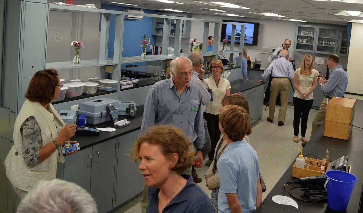 Visitors to Harbor Watch's new Richard Harris Laboratory at Earplace check out the facilities after the dedication ceremony.