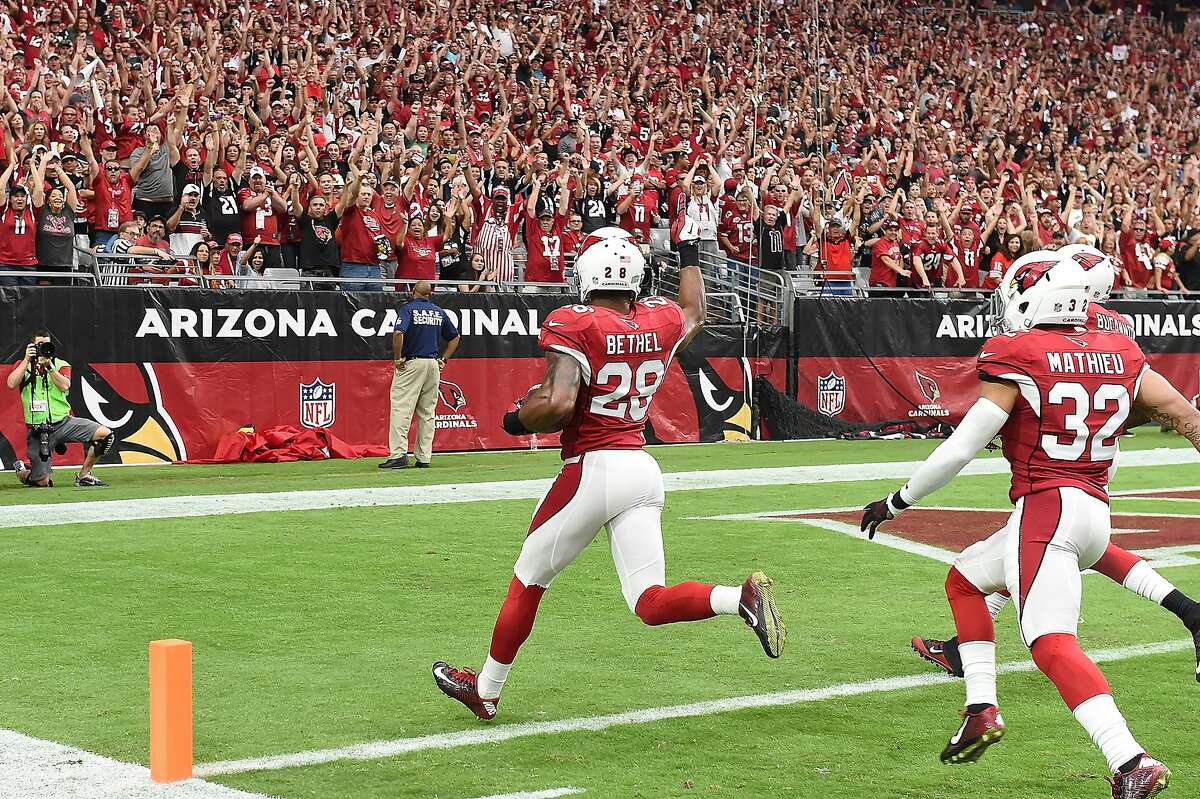 GLENDALE, AZ - SEPTEMBER 27: Cornerback Justin Bethel #28 of the Arizona Cardinals intercepts the football for a touchdown in the first quarter during the NFL game against the San Francisco 49ers at the University of Phoenix Stadium on September 27, 2015 in Glendale, Arizona. (Photo by Norm Hall/Getty Images)