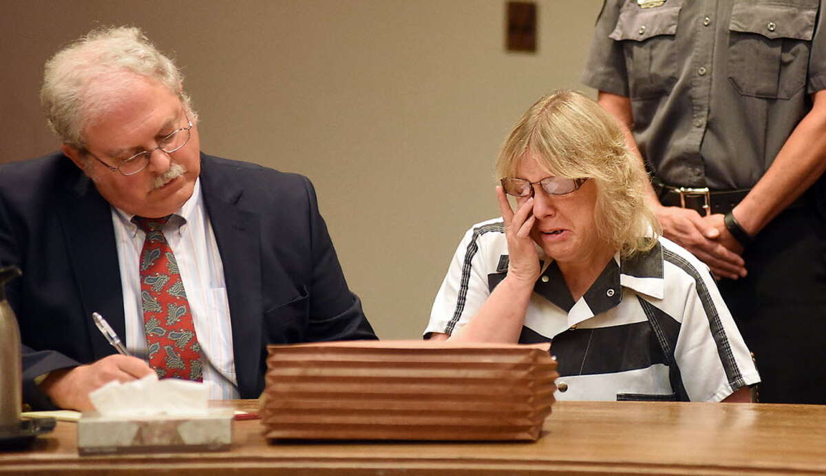 Joyce Mitchell cries as she sits with her attorney Stephen Johnston in court on Tuesday July 28, 2015 in Plattsburgh, N.Y. Mitchell, an instructor in the tailor shop at the Clinton Correctional Facility, pleaded guilty to charges of aiding two inmates convicted of murder by smuggling hacksaw blades and other tools to the pair, who broke out and spent three weeks on the run in June. She faces a sentence of 2 1/3 to 7 years in prison under terms of a plea deal with prosecutors. (Rob Fountain/The Press-Republican via AP, Pool)