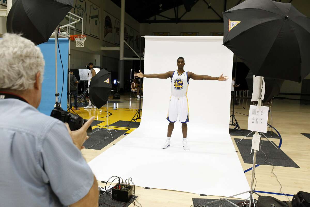 Harrison Barnes poses for a photo by NBA photographer, Steve Yeater, left, as the Golden State Warriors met with the press during their annual Media Day on Monday, October 1, 2012, at the teamâ€™s Practice Facility in Oakland, Calif. Players discussed the upcoming 2012-13 NBA season.