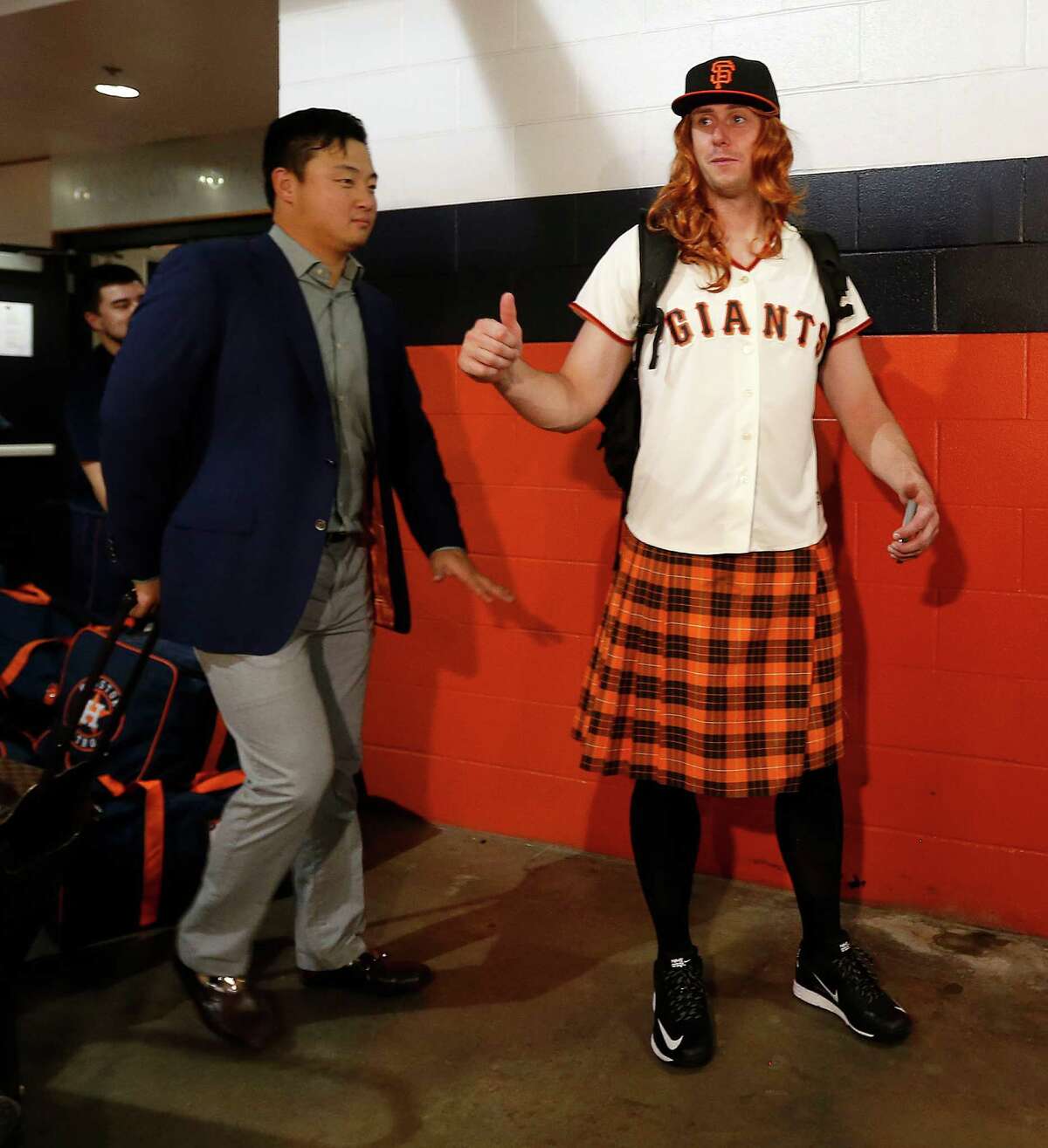 Matt Duffy, right, was one of the Astros' rookies who had to travel to Seattle in costume, with his kilt and Giants jersey ensemble an homage to the San Francisco rookie of the same name.