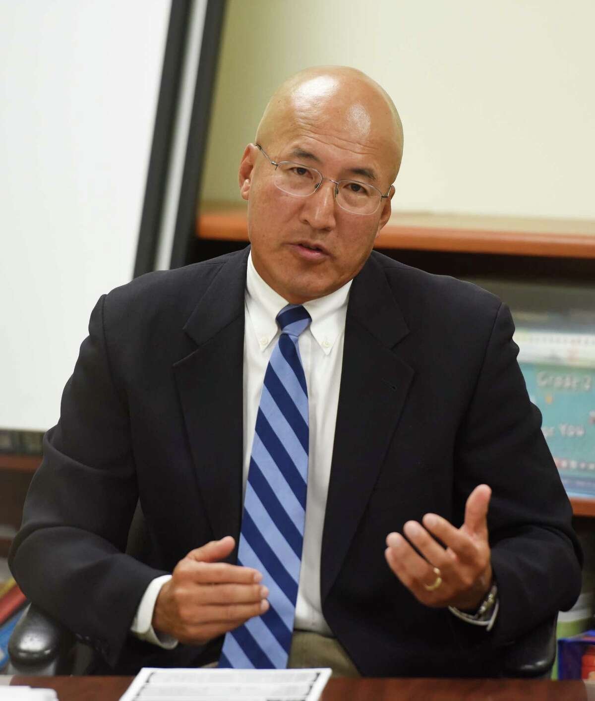 Suspended Greenwich High School band director John Yoon speaks during his hearing at the Greenwich Board of Education in Greenwich, Conn. Monday, Sept. 21, 2015. Yoon has been suspended after allegedly bullying two students last school year.