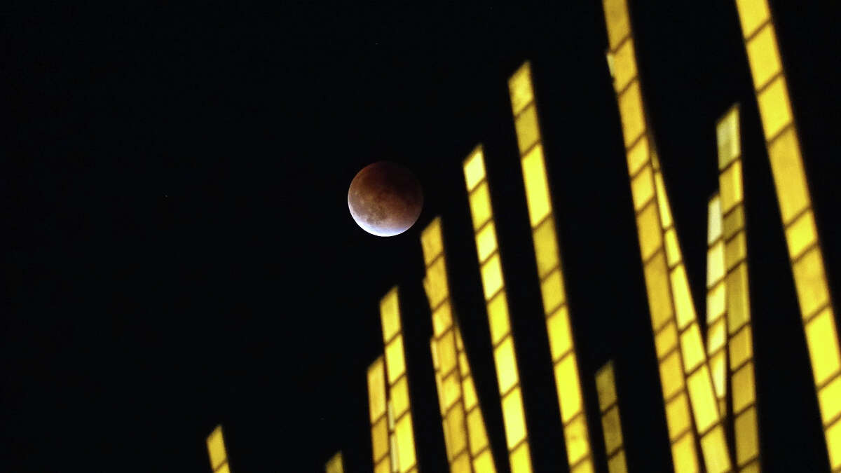 A total lunar eclipse in the phase of a “supermoon” as seen from Seattle Center on Sunday, Sept. 27, 2015. 