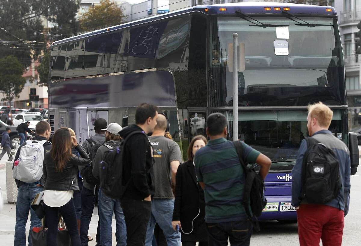A shuttle bus driven by Tracy Kelley pulls into a stop at Van Ness Avenue and McAllister Street to pick up Yahoo employees in San Francisco, Calif. on Tuesday, Sept. 29, 2015.