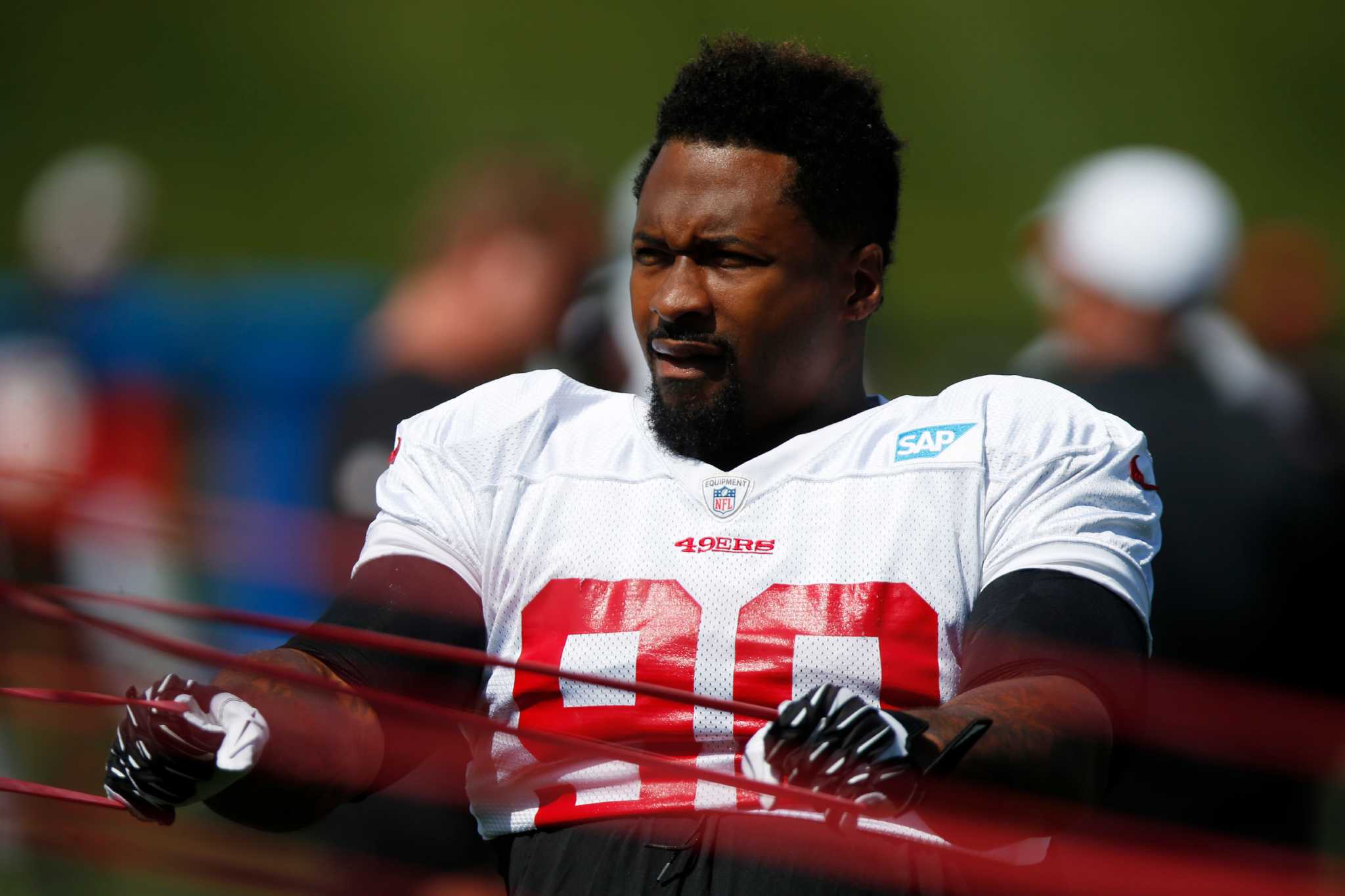 49ers coach Jim Tomsula says Reggie Bush has calf strain, 'looks fine'