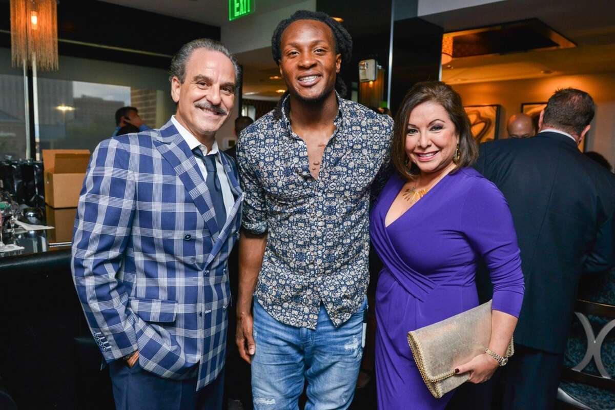 Rudy Festari, DeAndre Hopkins, Debbie Festari The Arian Foster Foundation hosted a fundraising event with Houston Texans teammates at Morton's Steakhouse in the Houston Galleria.