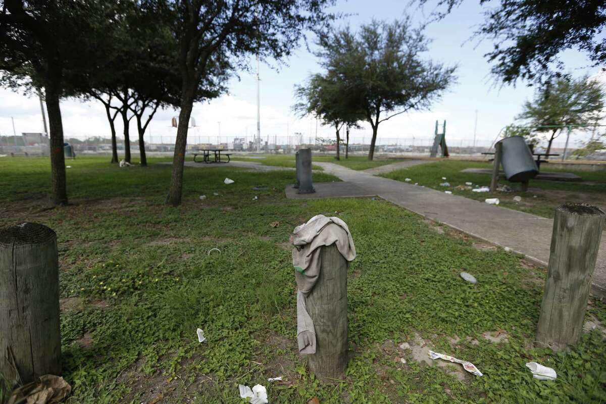 Trash and broken glass and bottles litter the Barbara Jordan Family Park, Lee and Wipprecht Streets, Tuesday, Sept. 29, 2015, in Houston. Areas of the Houston that are underserved by parkland, a problem an updated parks master plan is attempting to highlight. A prime example of the underserved area is Northline/Northside area, particularly close to the freeway