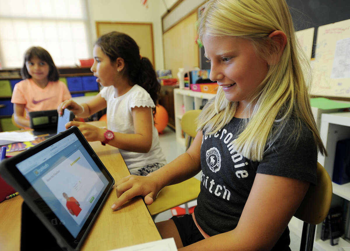 Kiki Cohen, 9, works with the learning program Khan Academy on her Ipad in her fifth grade classroom at Riverside School in Greenwich, Conn. on Thursday, September 24, 2015.