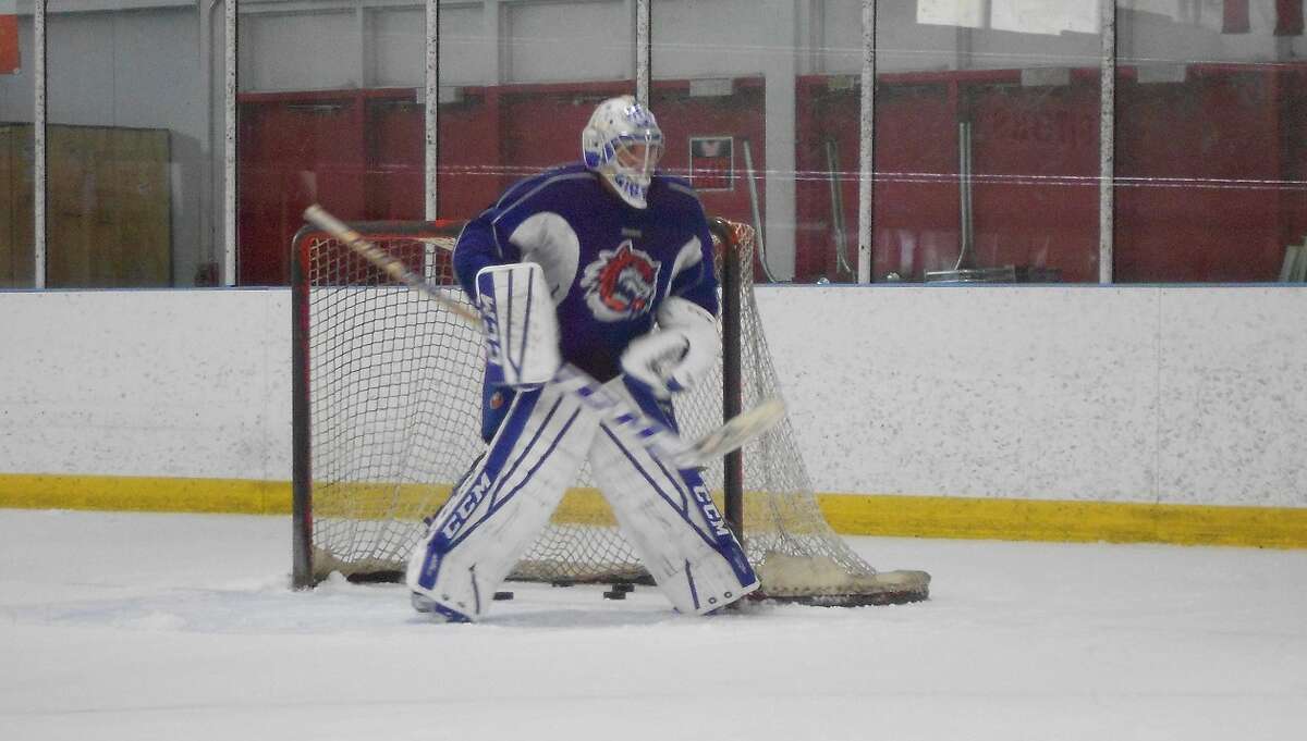 Bridgeport Sound Tigers goalie Chris Gibson prepares to take a shot in practice at the Wonderland of Ice in Bridgeport on Tuesday. Gibson was one of five players the parent New York Islanders acquired in a trade this month who are in training camp with the Sound Tigers.
