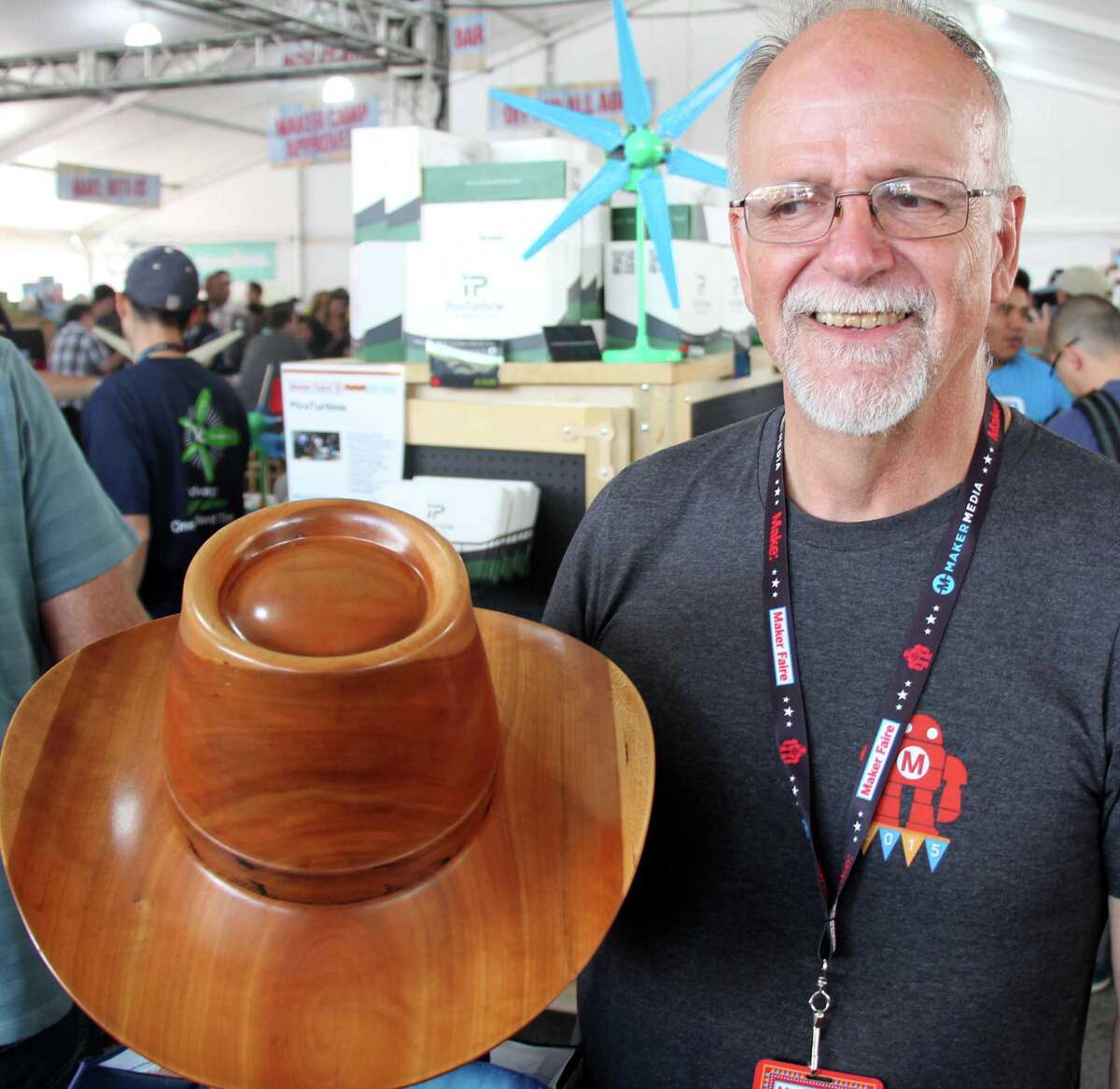 Carl Stoner displays the hat that he fashioned from wood at the World Maker Faire in New York.