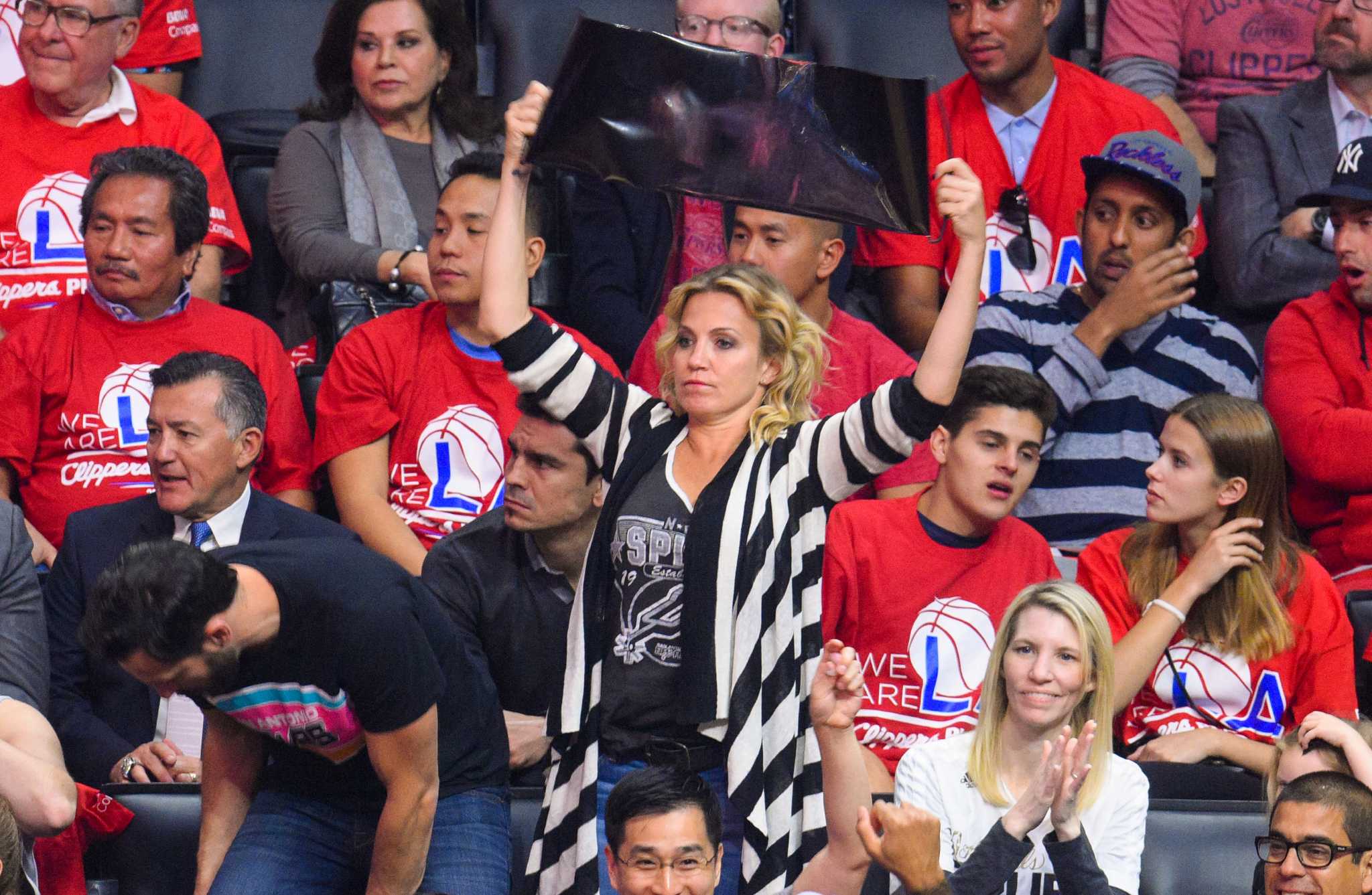 Selena Gomez attends the San Antonio Spurs vs LA Lakers basketball game -  Leather Celebrities